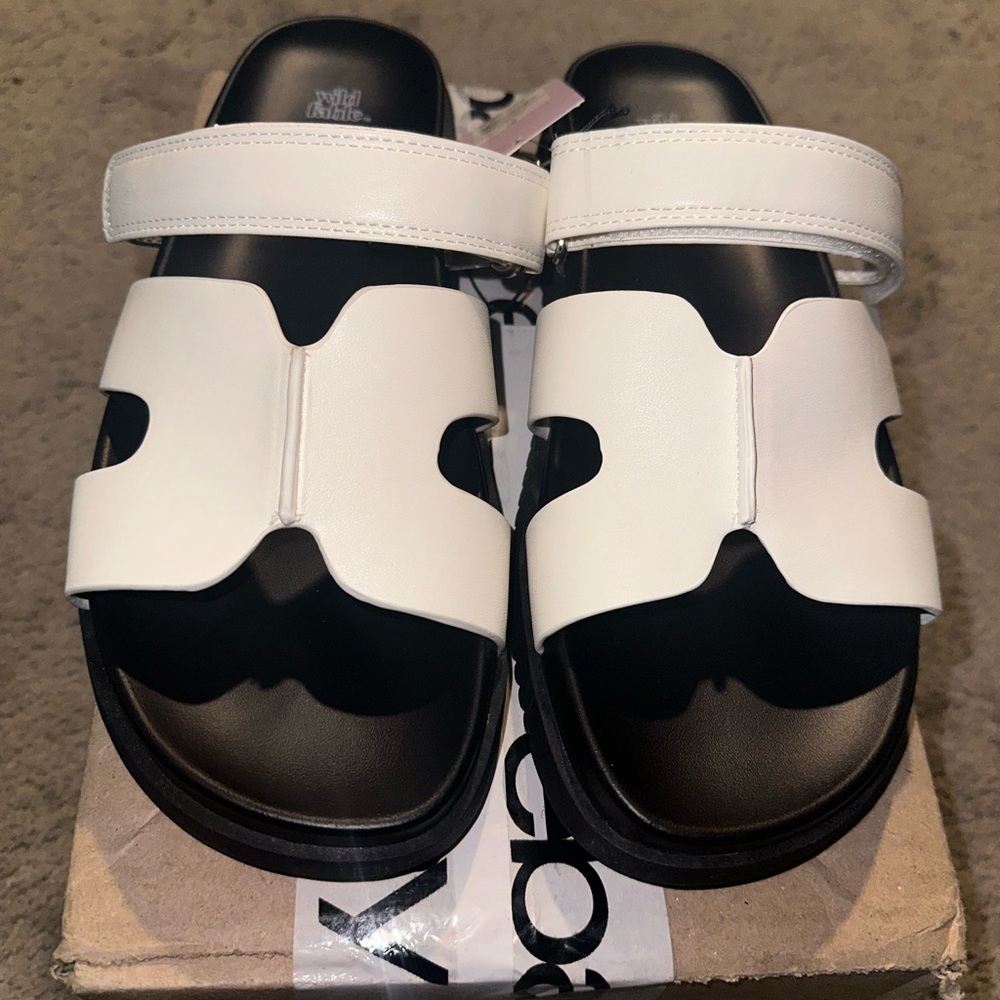 Omans white and black sandals